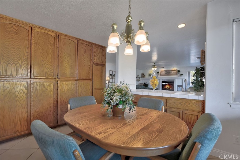 18032 Ohna Road Apple Valley, CA 92307 - Photo 19 of 65 a dining room with furniture and window