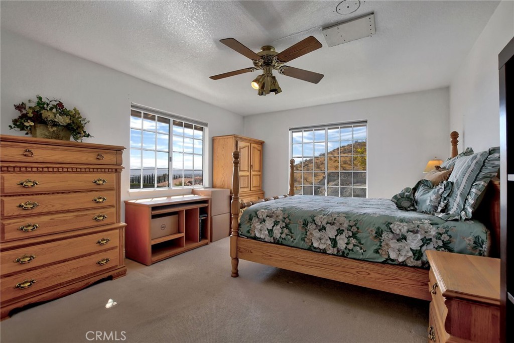 18032 Ohna Road Apple Valley, CA 92307 - Photo 29 of 65 a bed room with a bed and a window