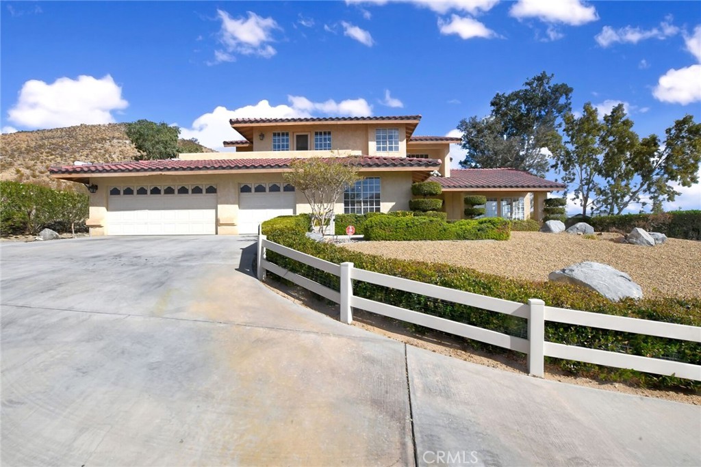 18032 Ohna Road Apple Valley, CA 92307 - Photo 4 of 65 a view of a house with a yard and sitting area