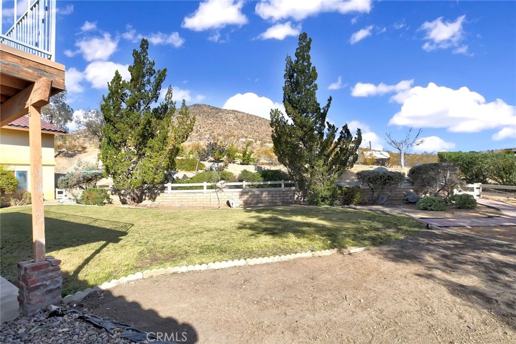 18032 Ohna Road Apple Valley, CA 92307 - Photo 48 of 65 a view of a yard with a fountain