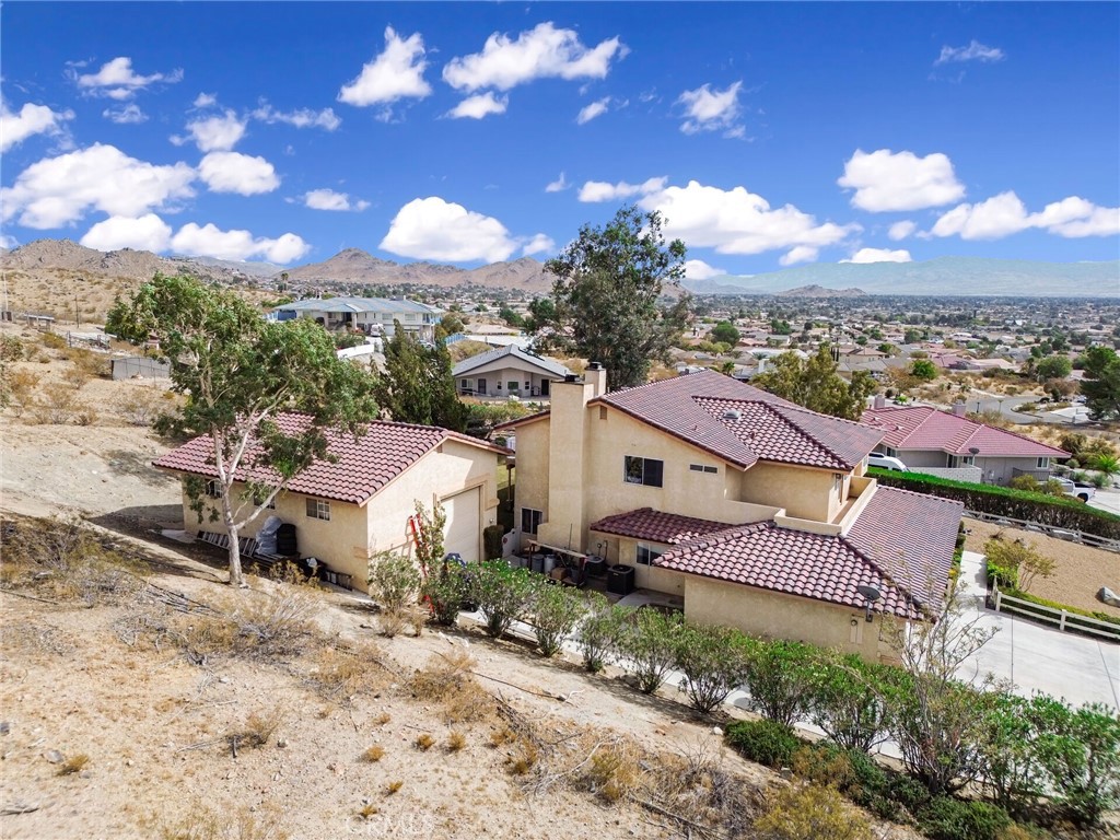 18032 Ohna Road Apple Valley, CA 92307 - Photo 53 of 65 a aerial view of a house with a yard