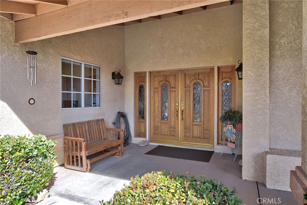 18032 Ohna Road Apple Valley, CA 92307 - Photo 6 of 65 a view of front door of a house
