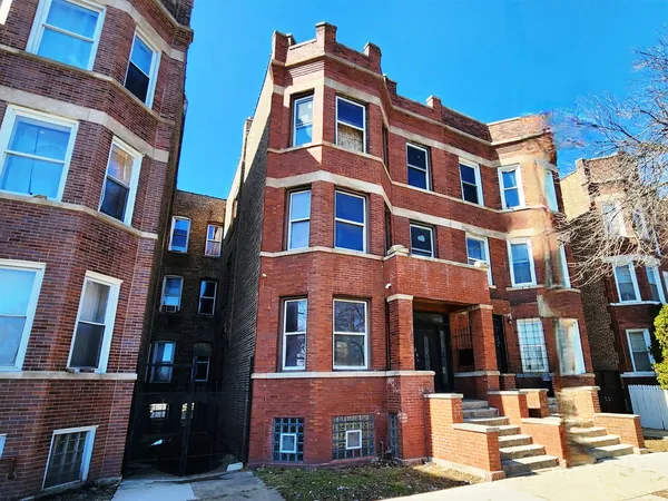 a front view of a building with many windows