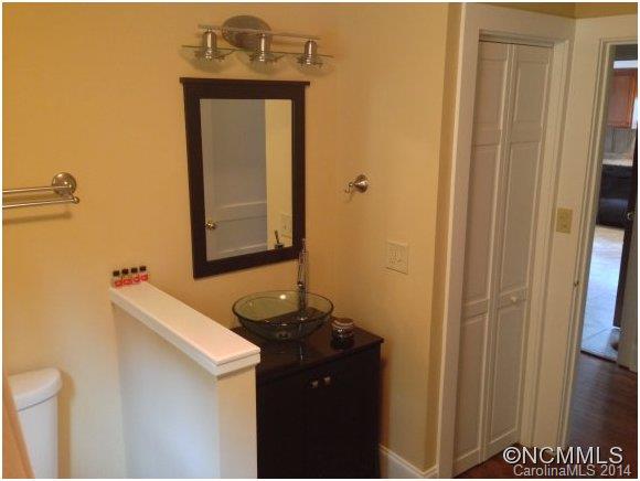 1189 John Foster Road Columbus, NC 28722 - Photo 9 of 12 a bathroom with a sink and a mirror