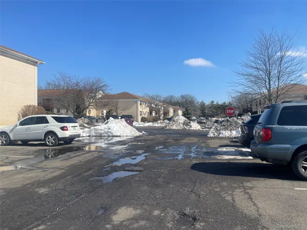 a view of street with parked cars