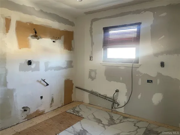 a bathroom with a glass shower door