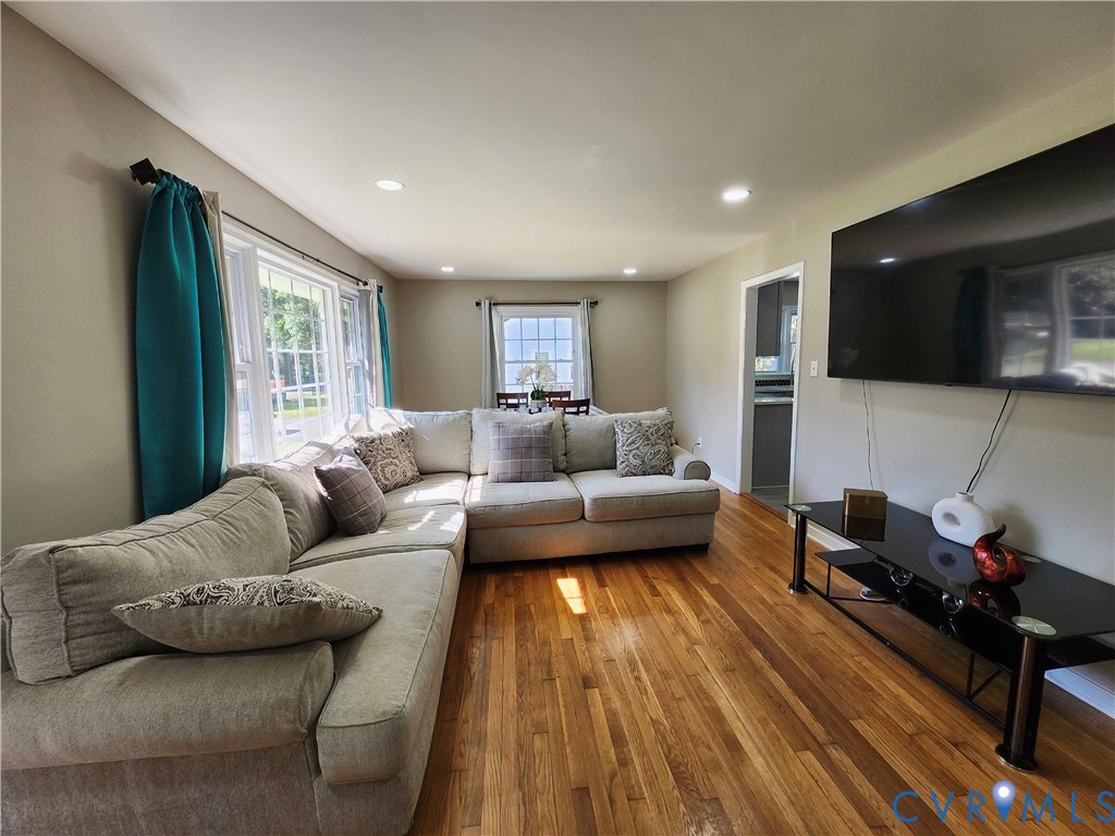 2718 Stacie Road Richmond, VA 23224 - Photo 5 of 50 Spacious living area featuring wood-finish floorin