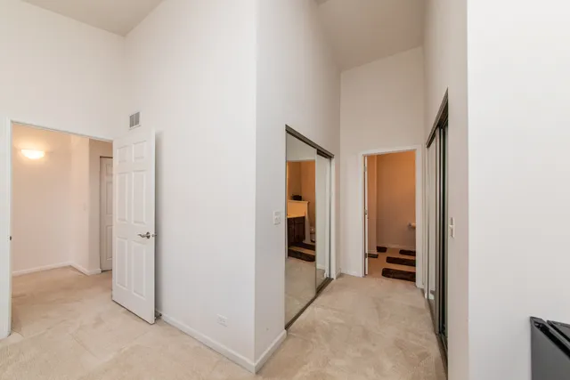 a view of a room with a hallway and toilet