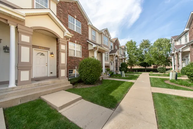 a view of a building with a yard