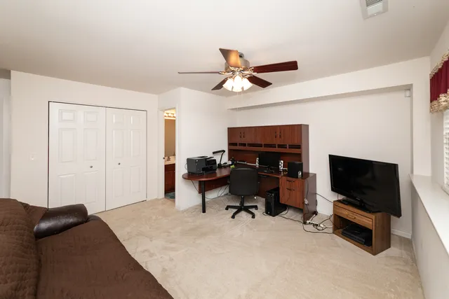 a bedroom with a workspace