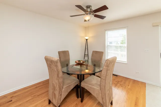 a view of a dining room with furniture and window