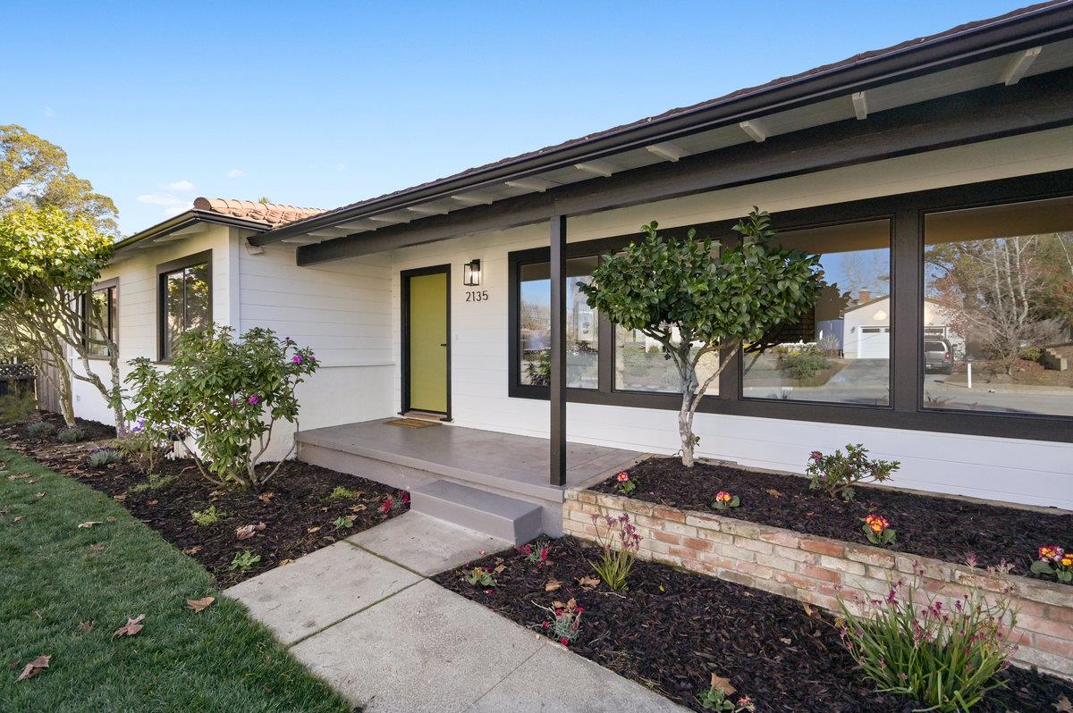 2135 Queens Lane San Mateo, CA 94402 - Photo 2 of 50 a front view of a house with garden