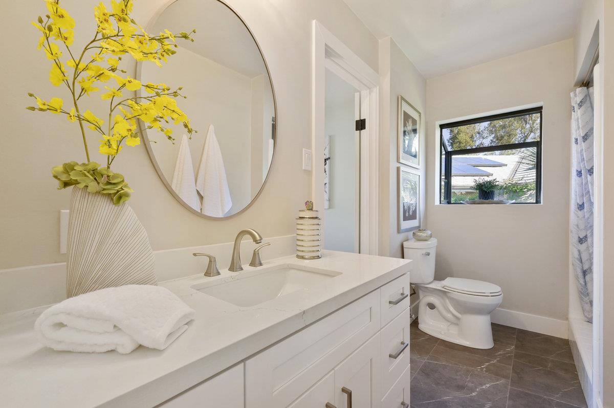 2135 Queens Lane San Mateo, CA 94402 - Photo 26 of 50 a bathroom with a sink vanity mirror and toilet