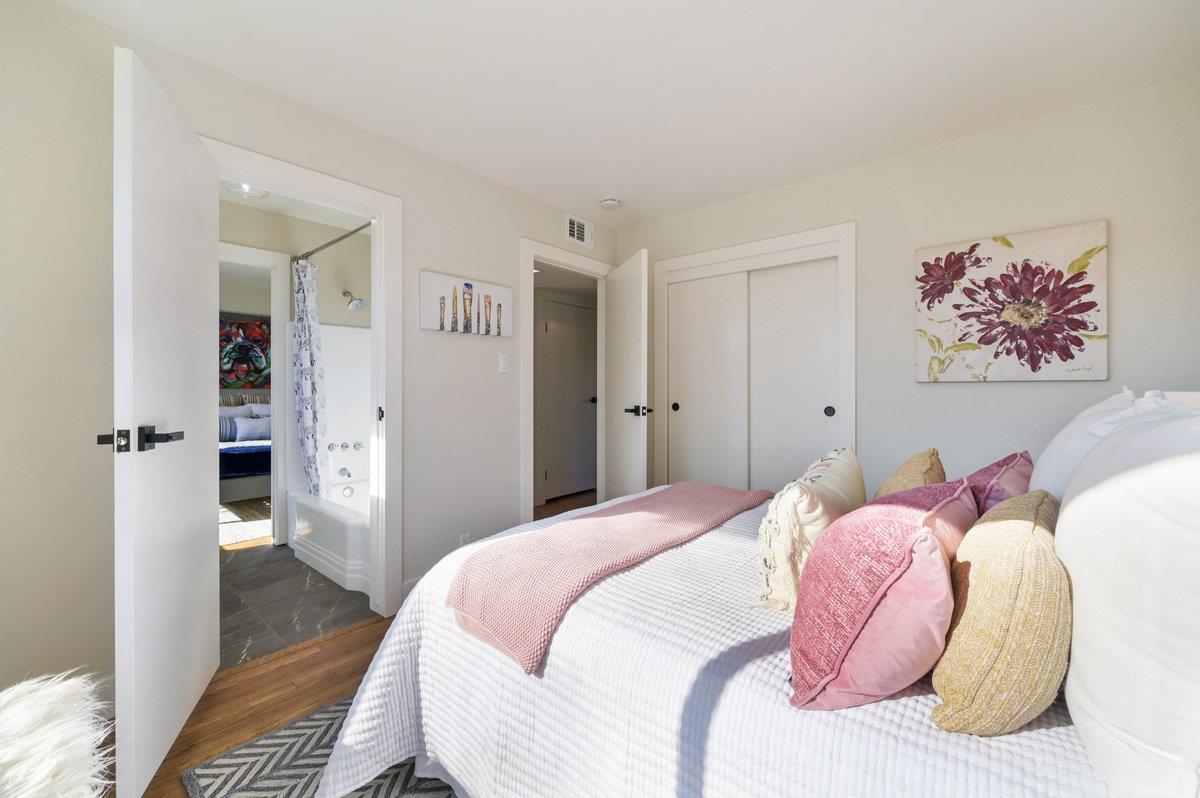 2135 Queens Lane San Mateo, CA 94402 - Photo 28 of 50 a bedroom with a bed and a view of bathroom
