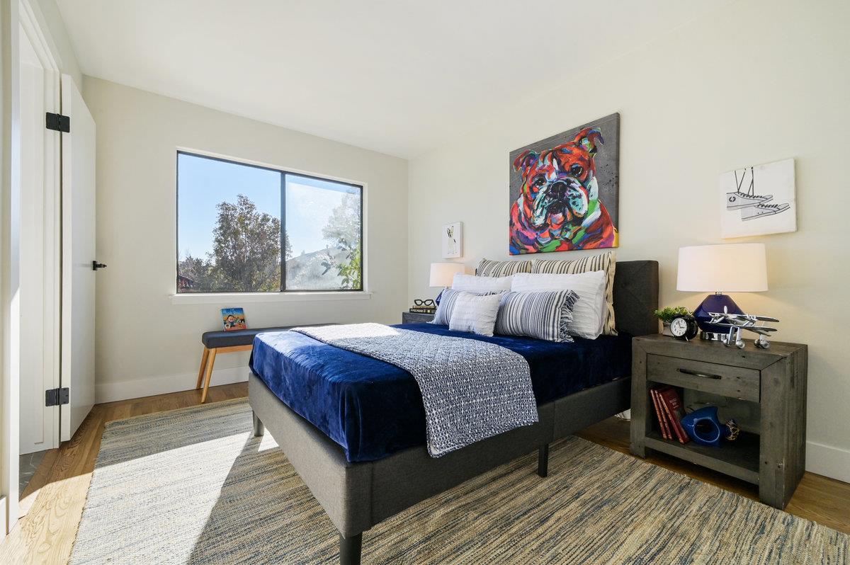 2135 Queens Lane San Mateo, CA 94402 - Photo 30 of 50 a bed room with a bed and a fireplace