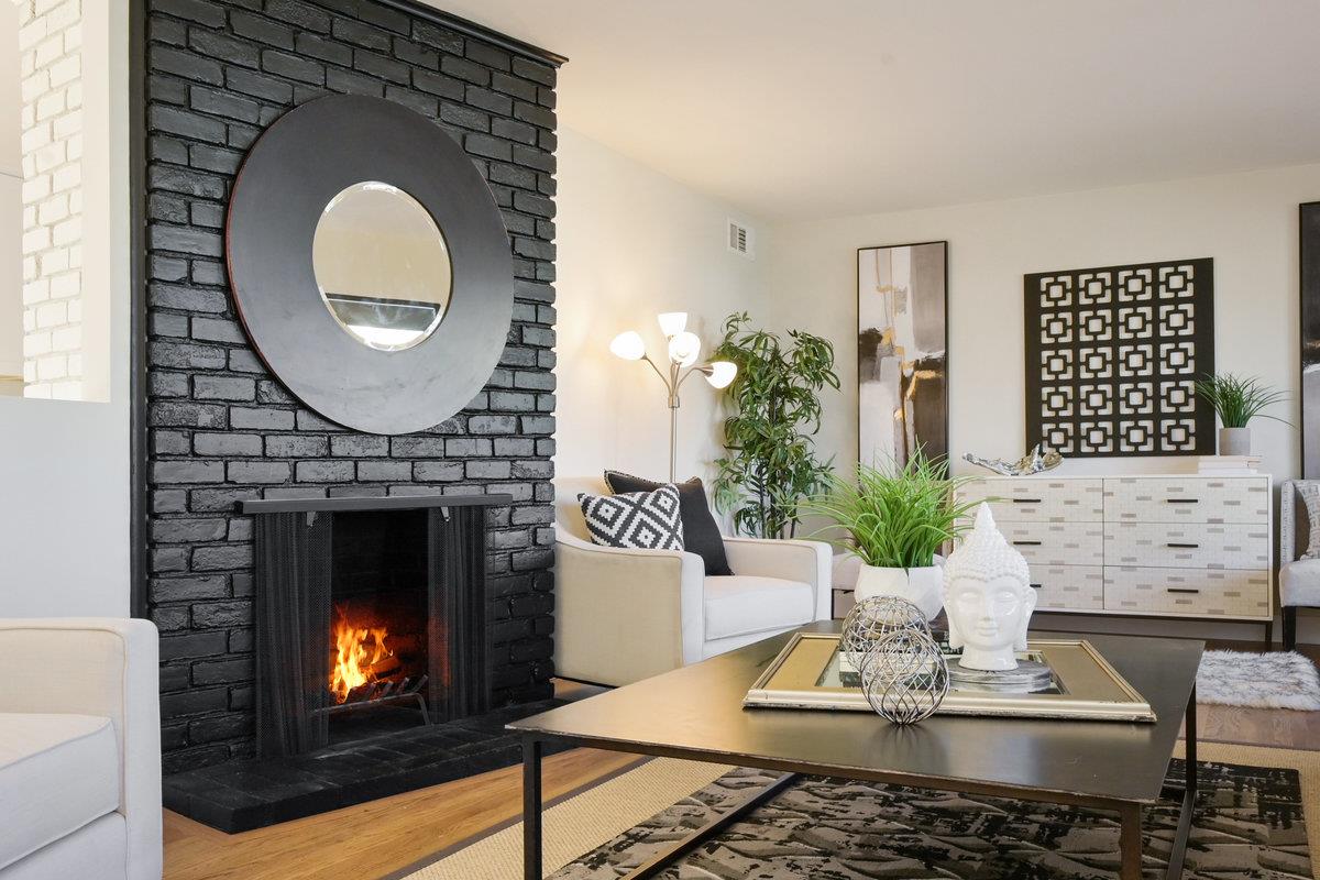 2135 Queens Lane San Mateo, CA 94402 - Photo 4 of 50 a living room with furniture a fireplace and a potted plant