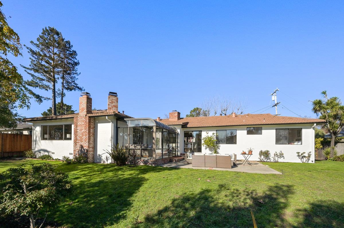 2135 Queens Lane San Mateo, CA 94402 - Photo 41 of 50 a front view of a house with a yard table and chairs