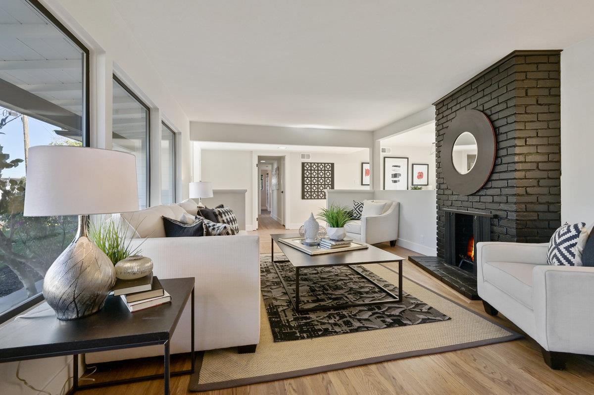 2135 Queens Lane San Mateo, CA 94402 - Photo 5 of 50 a living room with furniture and a fireplace