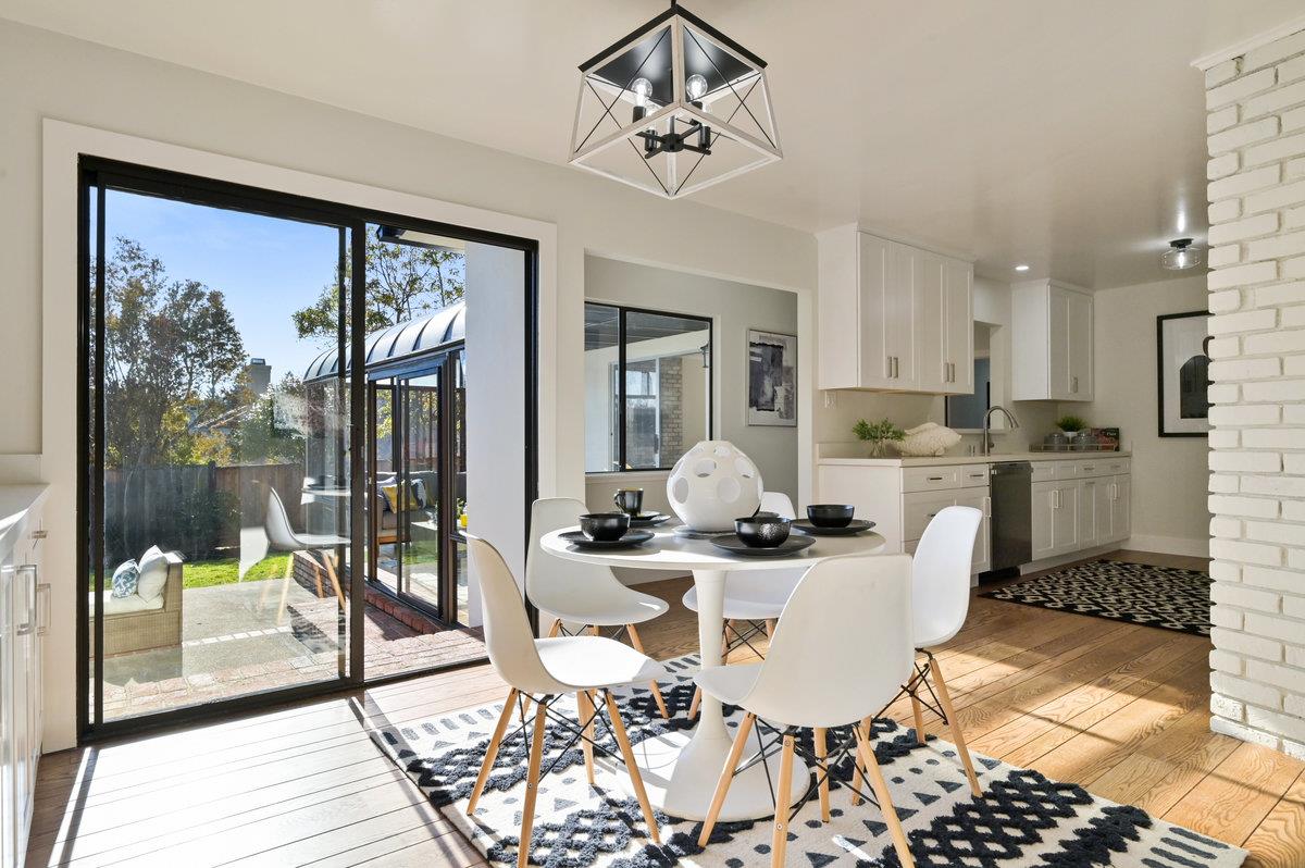 2135 Queens Lane San Mateo, CA 94402 - Photo 8 of 50 a dining room with wooden floor and a floor to ceiling window