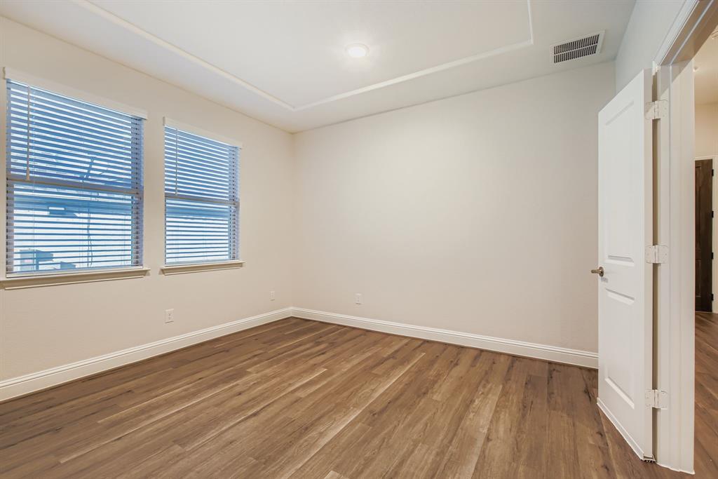 312 Magnolia Drive Oak Point, TX 75068 - Photo 6 of 28 Unfurnished room with wood finished floors