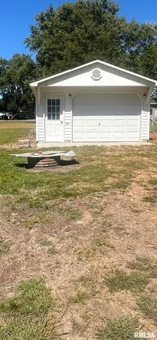 a view of a patio with a yard
