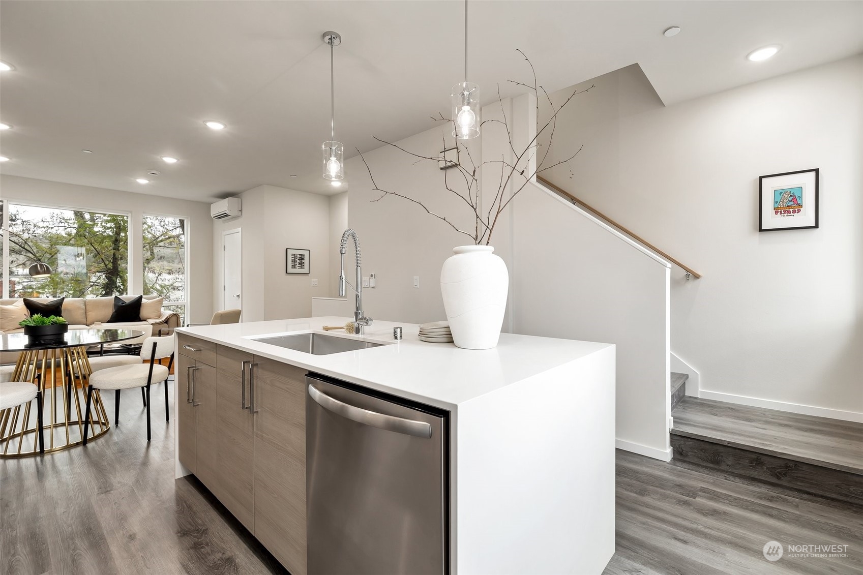4549 Renton Avenue South, Unit D Seattle, WA 98108 - Photo 2 of 15 a kitchen with a sink a counter space and appliances