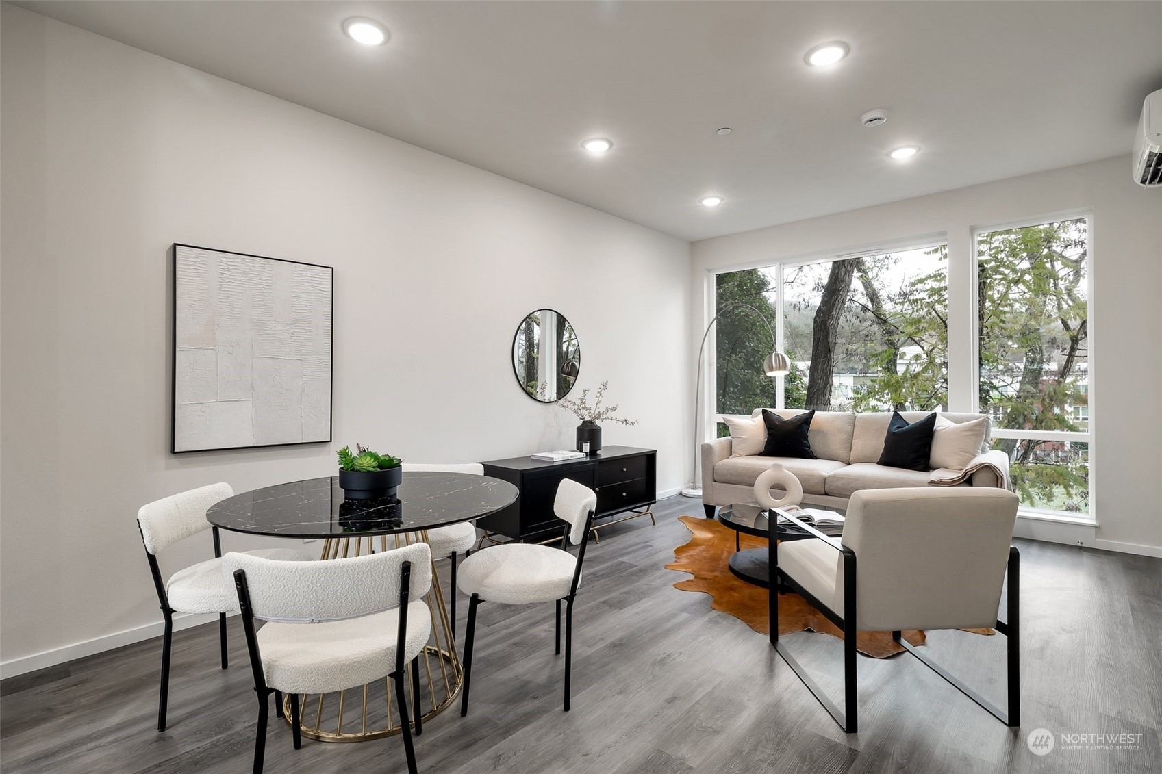 4549 Renton Avenue South, Unit D Seattle, WA 98108 - Photo 5 of 15 a living room with furniture and a large window