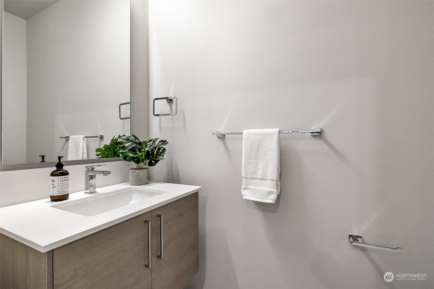 4549 Renton Avenue South, Unit D Seattle, WA 98108 - Photo 7 of 15 a bathroom with a sink and a mirror