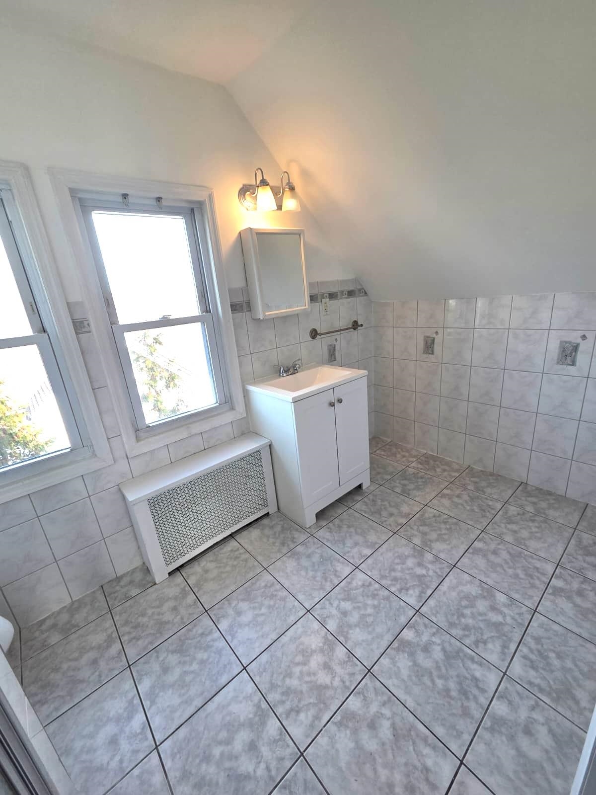 438 Devon Street, Unit 2 Kearny, NJ 07032 - Photo 17 of 27 a room with a cabinets and window