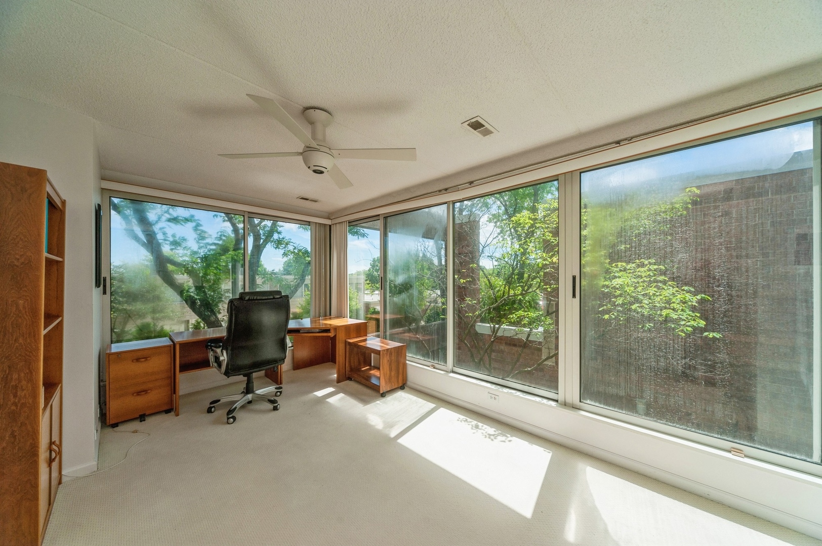 53 Avon Road Northbrook, IL 60062 - Photo 18 of 26 a view of a livingroom with workspace and a large window