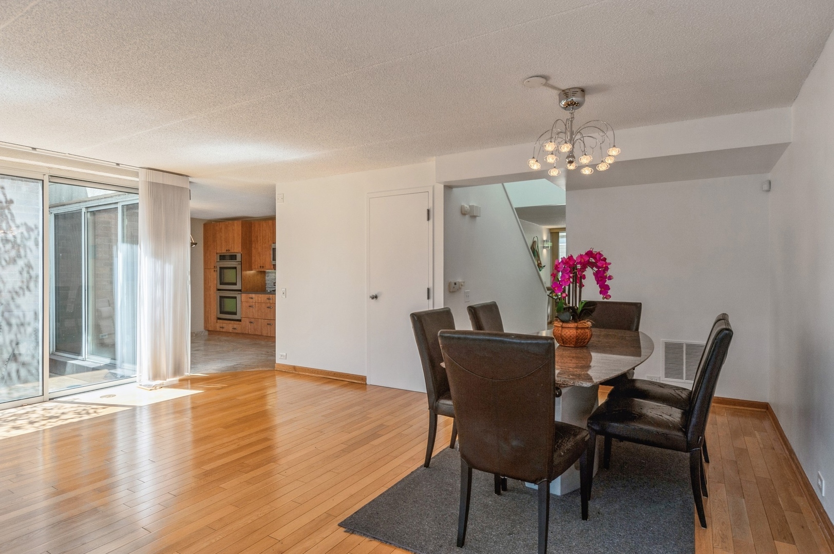 53 Avon Road Northbrook, IL 60062 - Photo 6 of 26 a view of a dining room with furniture and chandelier