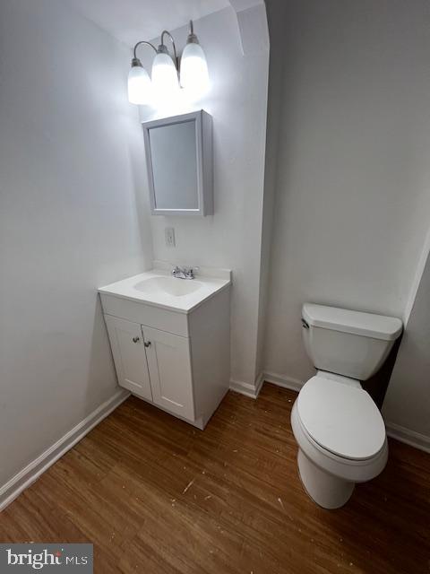 38 South Main Street, Unit A Glassboro, NJ 08028 - Photo 11 of 25 a bathroom with a toilet a sink and mirror