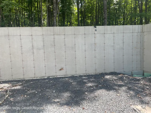 a view of a wooden fence and trees