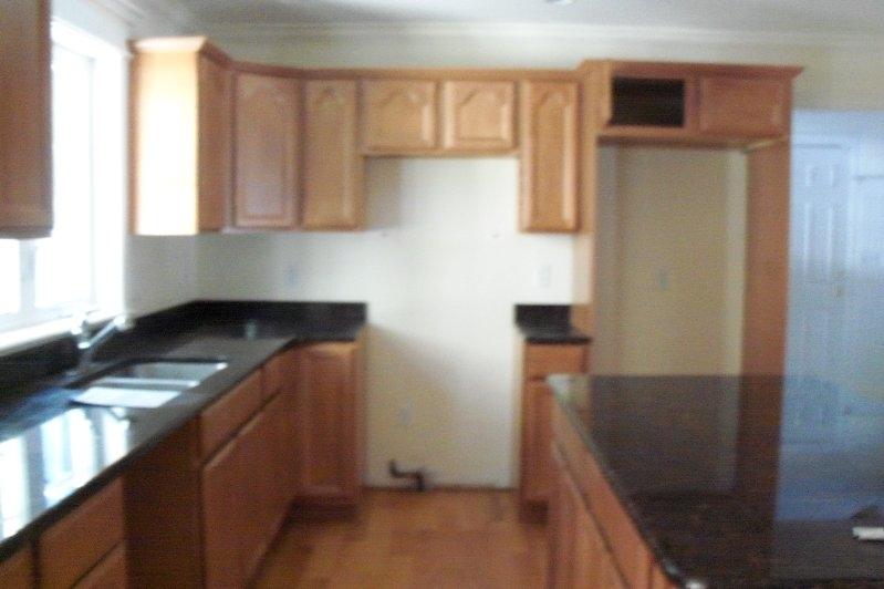 115 High Rise Road Otis, MA 01253 - Photo 2 of 4 a kitchen with stainless steel appliances granite countertop a refrigerator and a stove