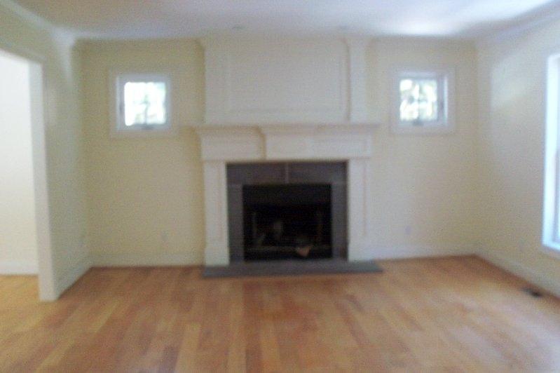 115 High Rise Road Otis, MA 01253 - Photo 3 of 4 an empty room with a fireplace