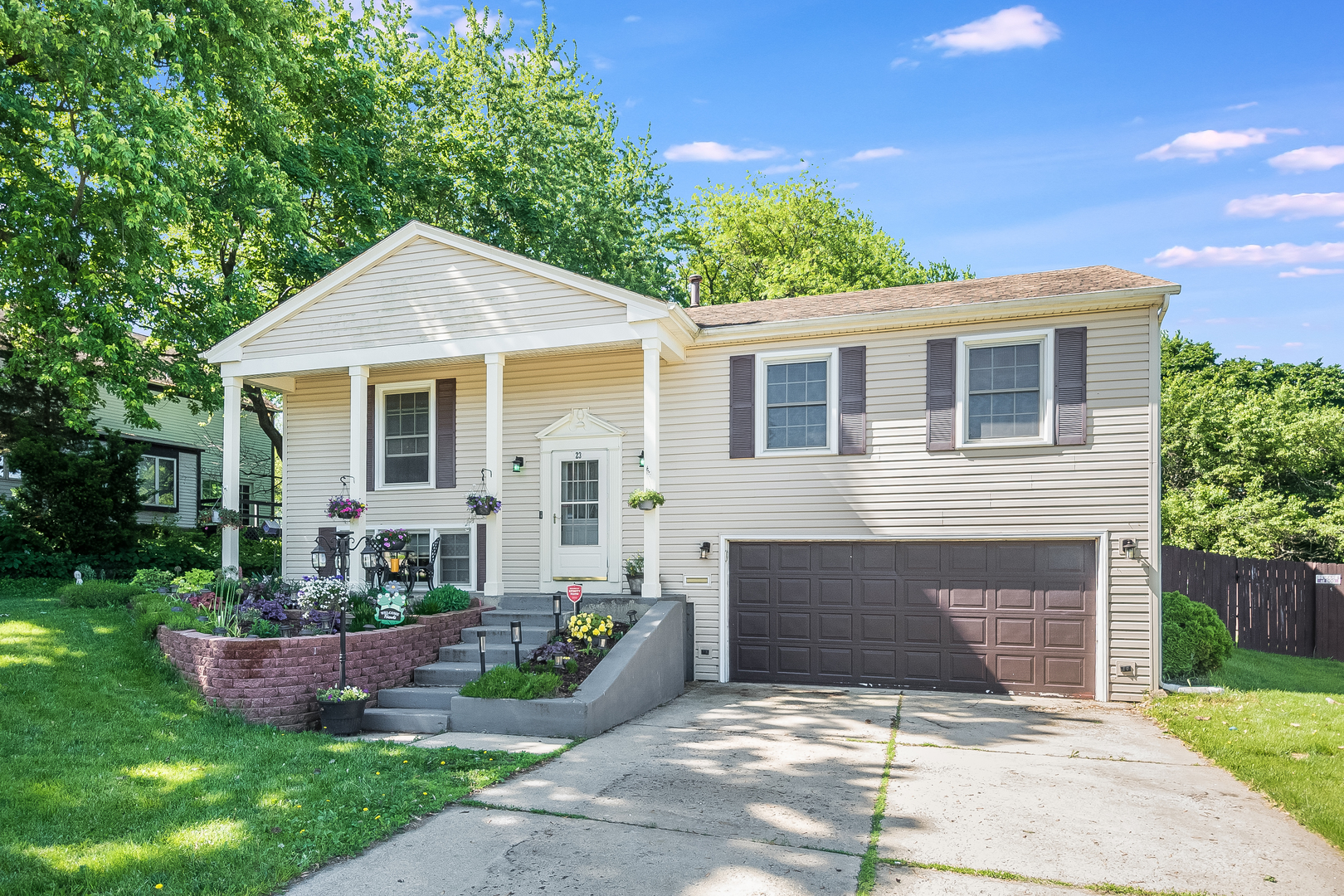 23 Fernwood Road Montgomery, IL 60538 - Photo 1 of 17 a front view of a house with a garden