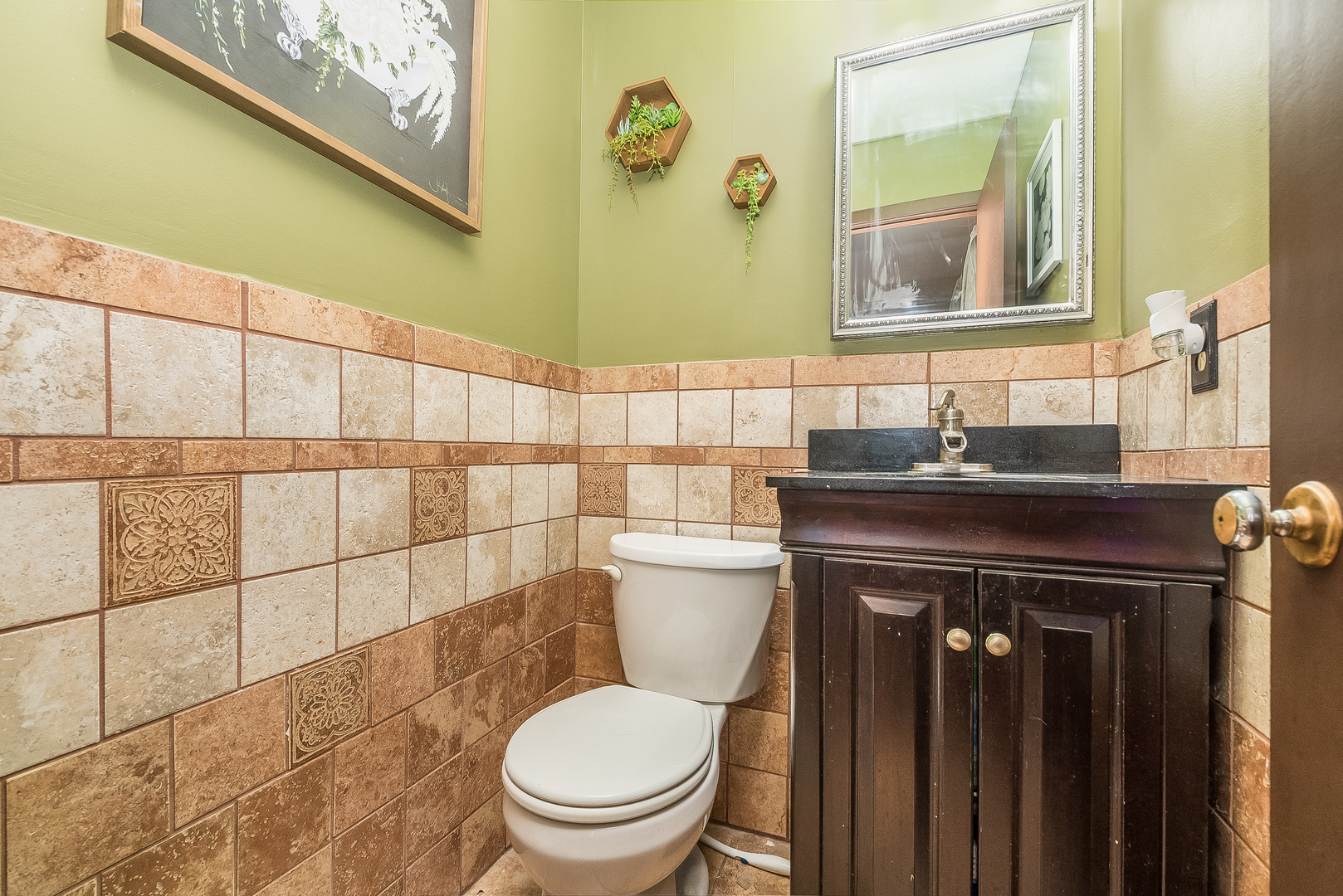23 Fernwood Road Montgomery, IL 60538 - Photo 8 of 17 a bathroom with a sink a toilet and a mirror