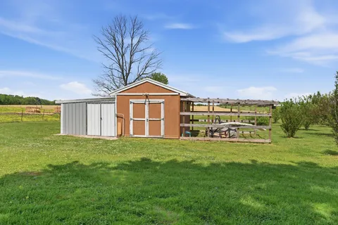 a view of a house with a big yard