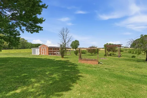a view of a house with a big yard
