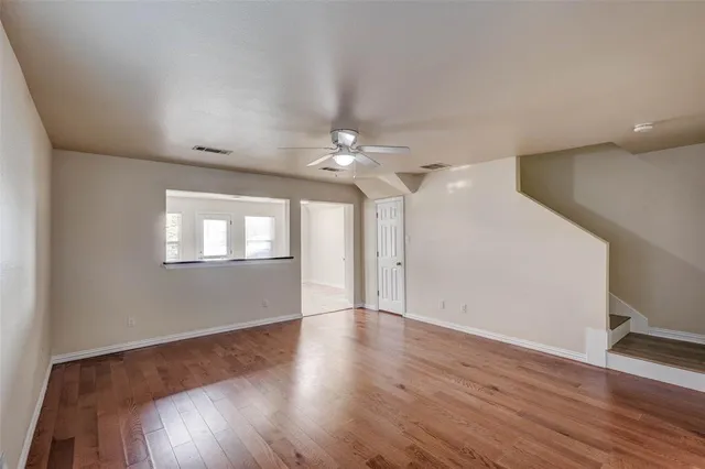 a bathroom with a sink mirror and toilet