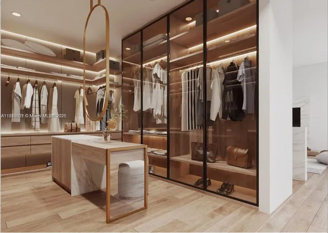 a kitchen with counter top space and front door