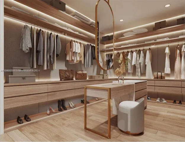 a kitchen with a sink and chairs