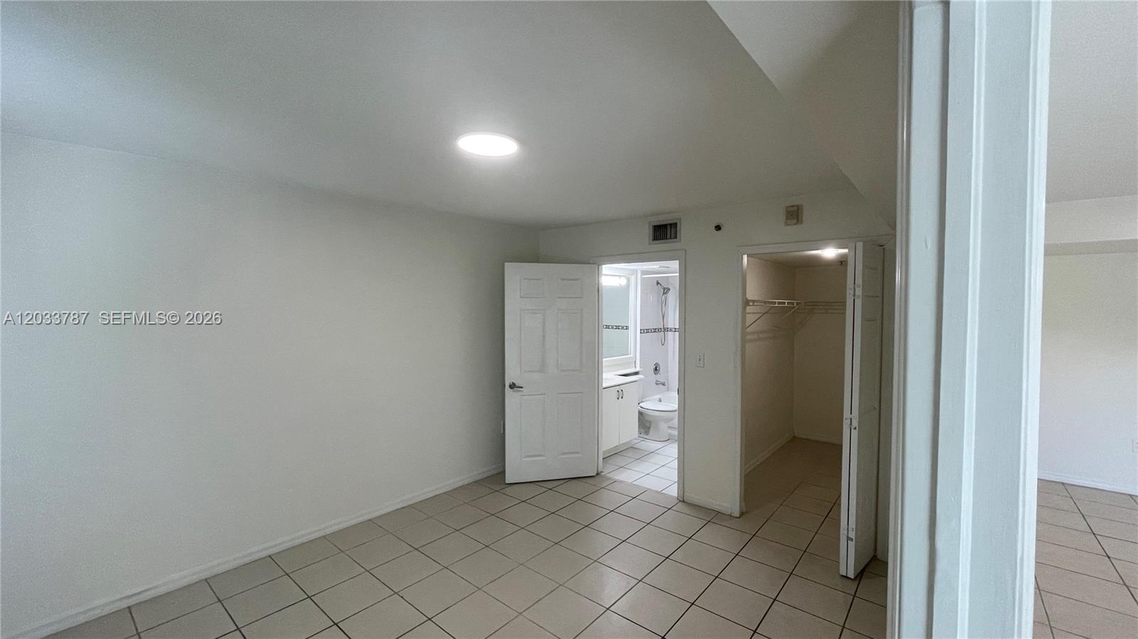 2475 Northwest 16th St Road, Unit 309 Miami, FL 33125 - Photo 9 of 16 Primary Bedroom