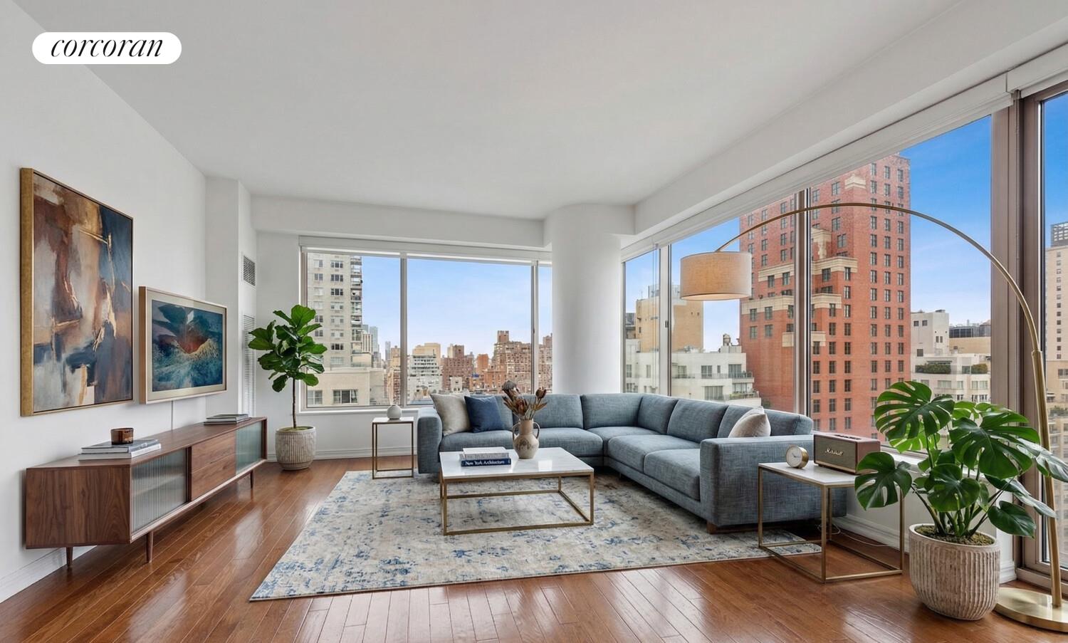 200 East 69th Street, Unit 21A Manhattan, NY 10021 - Photo 10 of 12 a living room with furniture potted plant and a large window