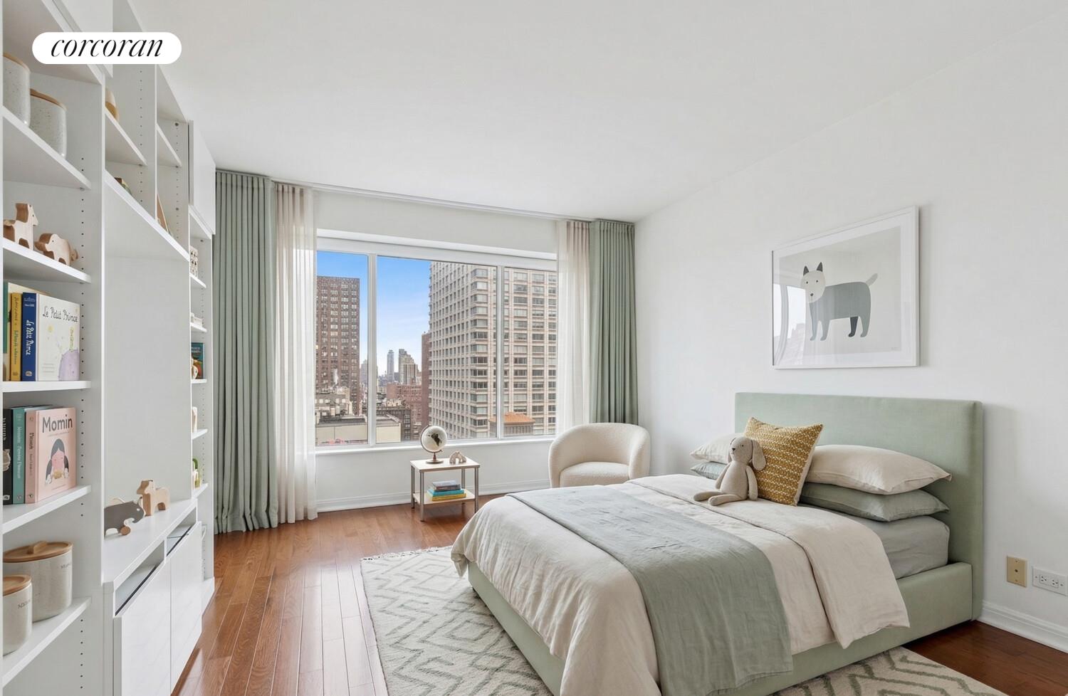 200 East 69th Street, Unit 21A Manhattan, NY 10021 - Photo 9 of 12 a bedroom with a bed and a large window