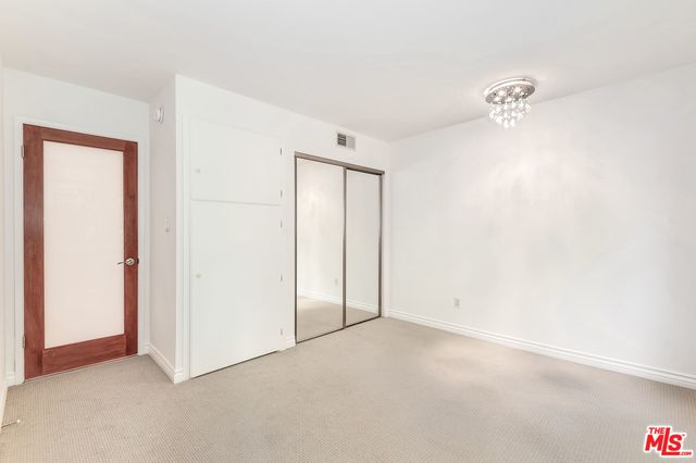 a view of empty room with windows