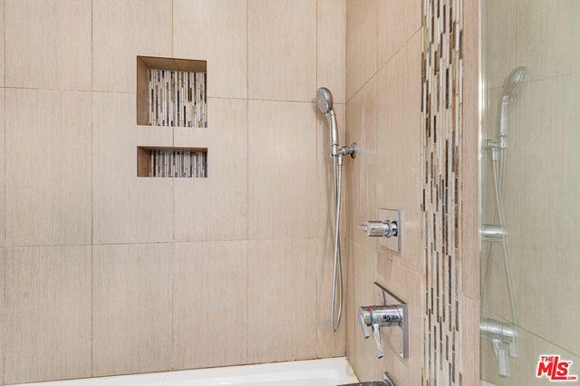 a bathroom with a bath tub