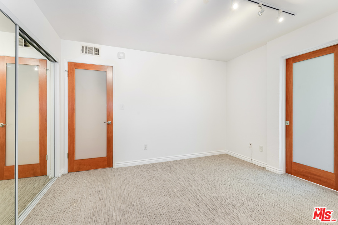 11750 Sunset Boulevard, Unit 123 Los Angeles, CA 90049 - Photo 17 of 31 an empty room with a empty space