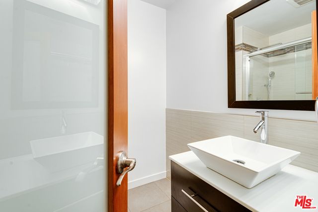 a view of a chairs and table in the back yard