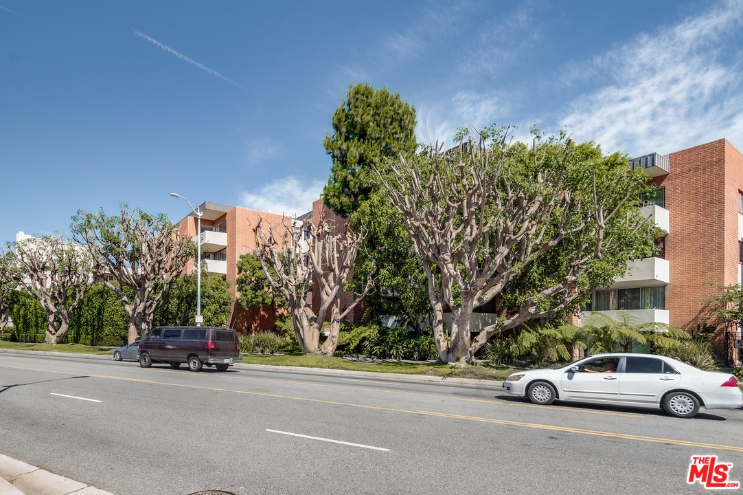 11750 Sunset Boulevard, Unit 123 Los Angeles, CA 90049 - Photo 27 of 31 a car parked on the side of a street
